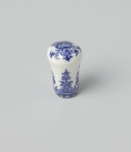 Cane knob with a flower vase and floral scrolls