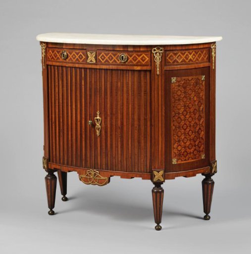 Cupboard with curved sides, cylinder doors, and a marble top