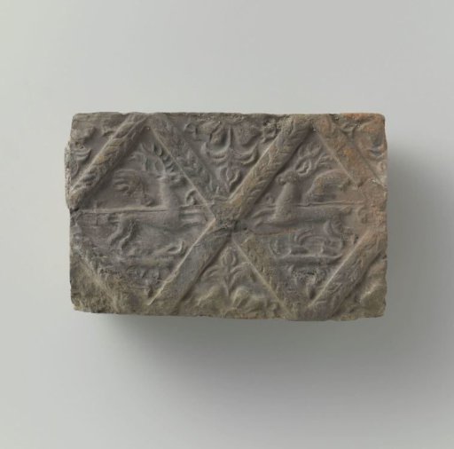 Fireplace with a depiction of two antlered stags, set in two panels