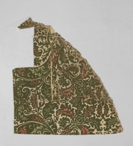 Wallpaper, velvety, with heavy vines with leaf and floral work above a wainscoting with panels, in green and red