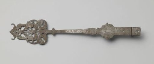 Door hinge of tinned iron, decorated with engravings and jester heads