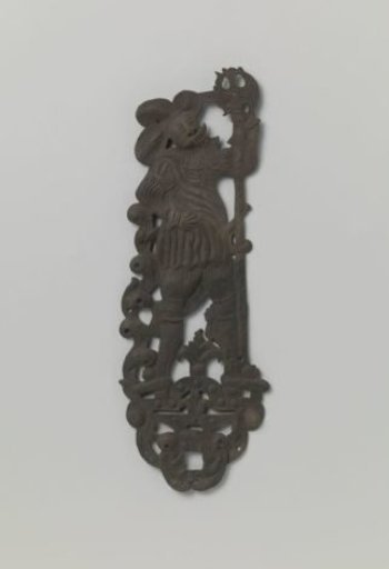 Plate in the shape of a warrior with a halberd