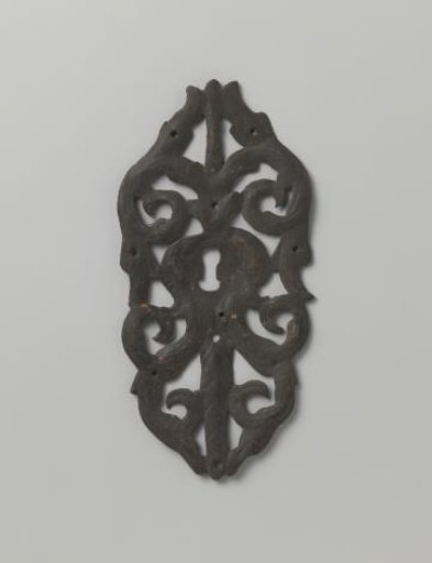 Key plate of tinned iron, decorated with vine motifs
