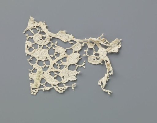 Fragment of a strip of needle lace with curling vines and various flowers