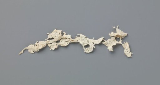 Fragment of a strip of needle lace with curling vines and various flowers