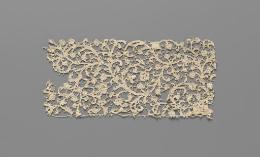 Strip of needle lace with continuous split vines