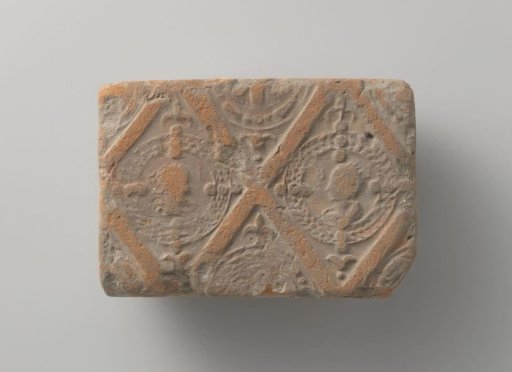 Fireplace surround depicting male and female heads, set in two panels