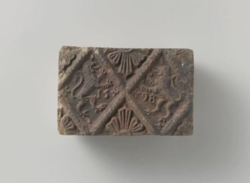 Fireplace tile depicting two climbing lions, placed in two panels
