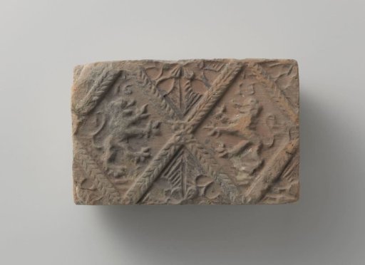 Fireplace tile depicting two climbing lions, placed in two panels