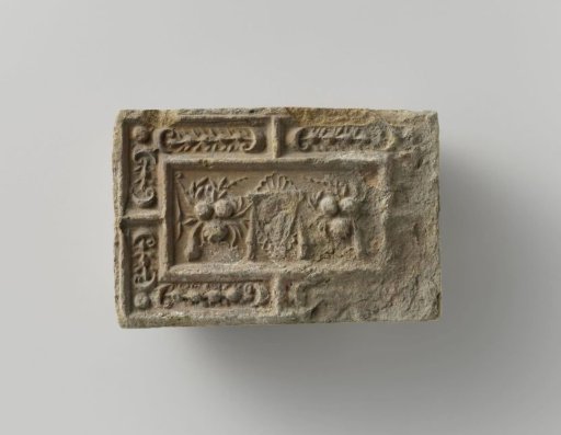 Fireplace with a Representation of a Mask Between Two Fruit Festoons