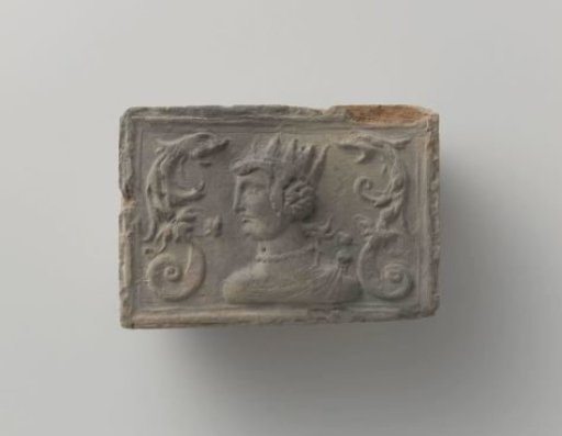 Fireplace with a crowned female head in the center