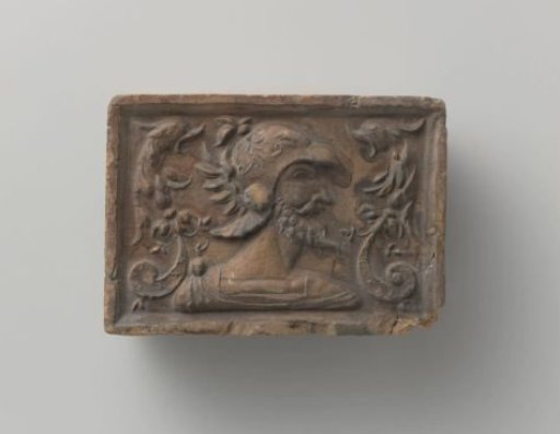 Fireplace with a head of a Roman soldier with a helmet