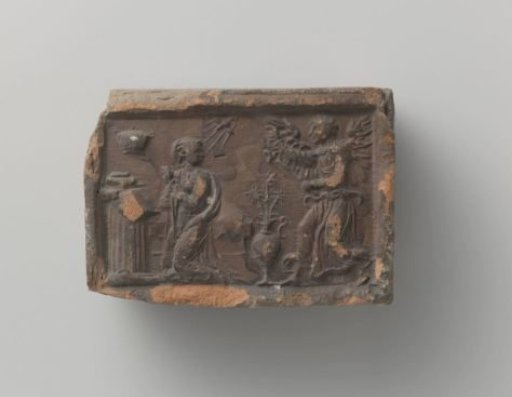 Fireplace mantle depicting Mary receiving the Annunciation