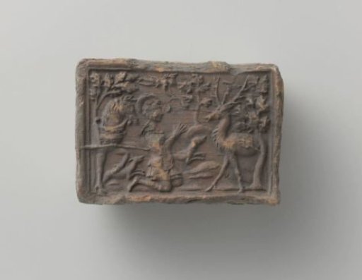 Fireplace mantle depicting Saint Hubertus and the stag with the cross