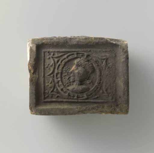 Fireplace with a Portrait in a Medallion Featuring a Striking Hairstyle