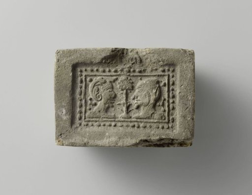 Fireplace with a man and woman looking at each other, a small tree between their heads