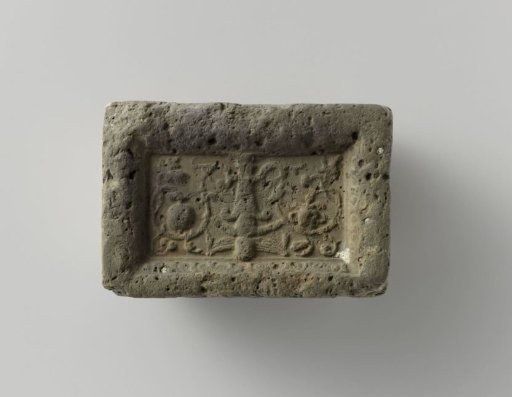 Fireplace with an angel among arabesques