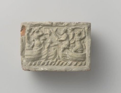 Fireplace with a depiction of a naval battle