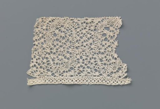 Strip of bobbin lace with ornamental bands and S-shaped tendrils with oval knobs