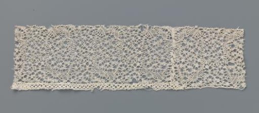 Strip of bobbin lace with ornamental bands and S-shaped tendrils with oval knobs