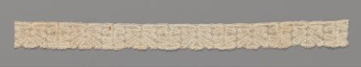 Strip of bobbin lace with tree motifs