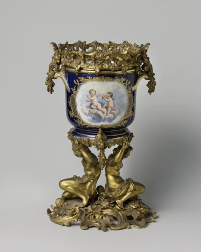 Jardinière with putti and floral scrolls, with a metal mount