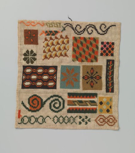 Embroidered panel of wool on coarse canvas