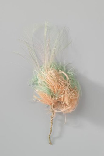 Tuft of various rose and green feathers, including ostrich feathers
