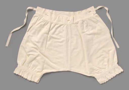 Drawers of white cotton with twill weave, the legs decorated at the bottom with braid and gathered festooned and scalloped edging