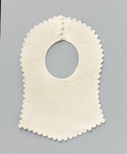 Slab of white cotton (?) with woven wave motif in relief and scalloped festooned border