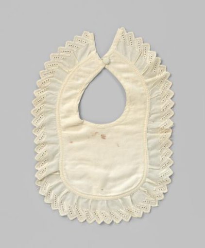 Slab of white cotton (?) with a backing with woven vertical stripes and a top layer with woven crystal-shaped scatter motif with scalloped border with English embroidery