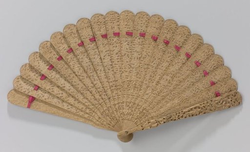 Brisé fan of cedarwood, carved in relief on both sides with Chinese representations