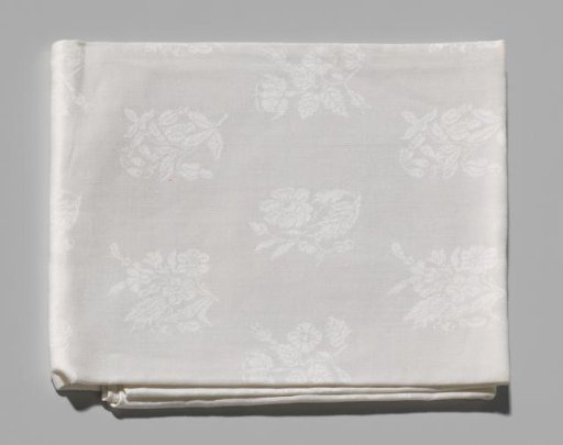 Linen damask napkin with floral motifs