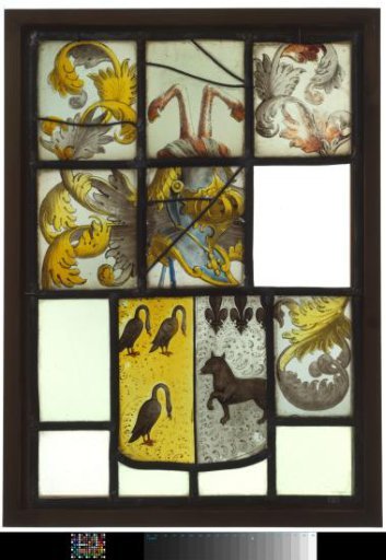 Pane with a quartered coat of arms featuring three lilies and a dog, and three black swans on gold as a crest, two horse legs