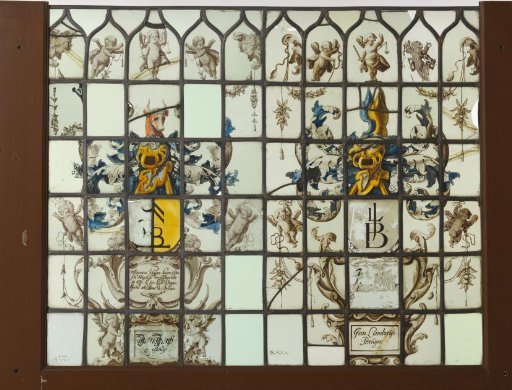 Pane with two cartouches and a coat of arms with a crest of two wings