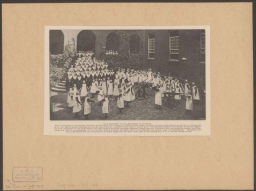 Orphans and nuns in the courtyard of the Maagdenhuis in Amsterdam