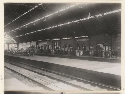 Waiting passengers on the platform of Amsterdam Weesperpoort Station