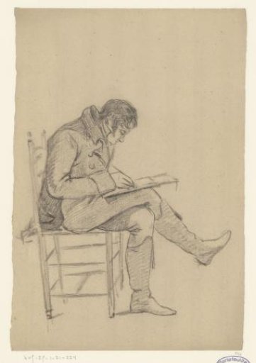 Man sitting drawing on a chair