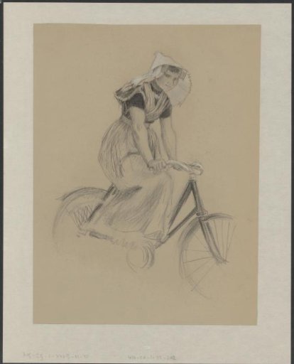 Woman in Zeelandic traditional dress on a bicycle