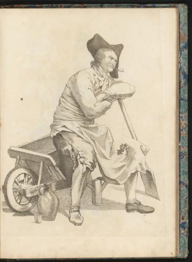 Man sitting on the edge of a wheelbarrow