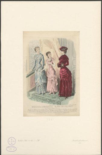 Two women and a girl standing on a staircase
