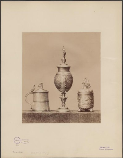 Two decorated cups and a trophy cup