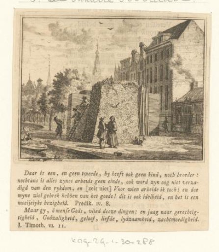 Two men standing before a bale of goods