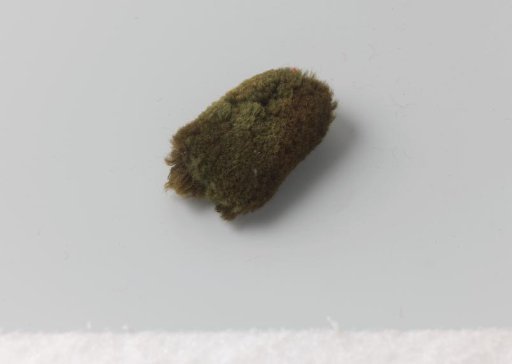 Remnants of wings of green wool, presumably for battalion and volunteer hunters