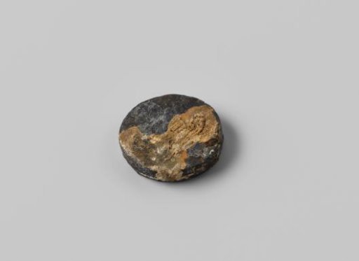 Two round corroded gaming tokens from the wreck of the East Indiaman Hollandia