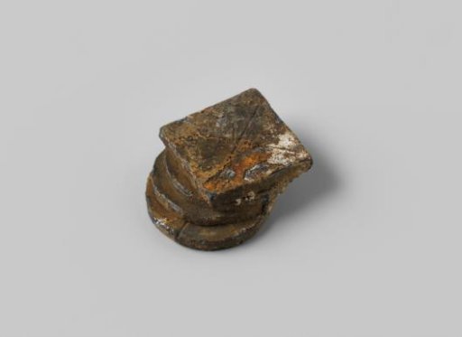 Three round and one square corroded toy medals from the wreck of the East Indiaman Hollandia
