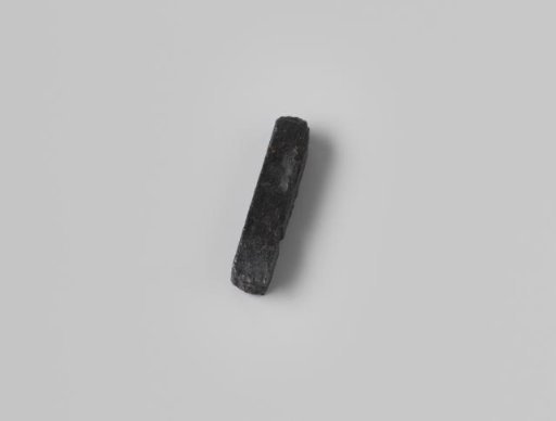 Printing type with the character M on one side and H on the other, from the wreck of the Dutch East India ship Hollandia
