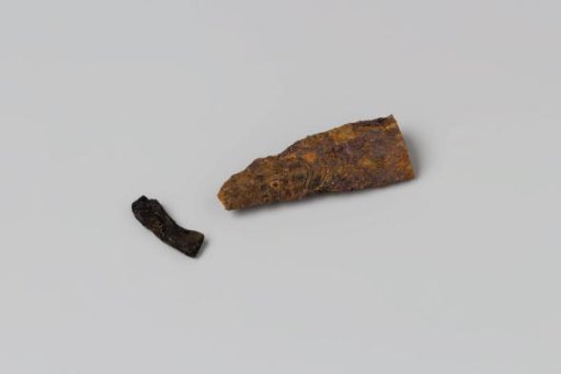Fragment of a knife handle and copper from the wreck of the East Indiaman Hollandia