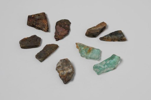 Shards of wine bottles and a cellar bottle from the wreck of the East Indiaman 't Vliegend Hart, lost in 1735