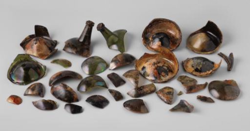 Sherds of wine bottles and a cork from the wreck of the East Indiaman 't Vliegend Hart